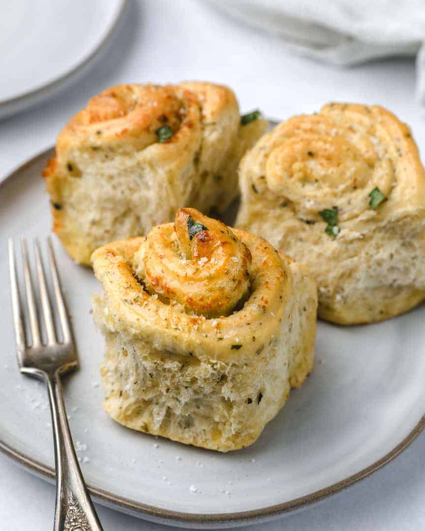 Garlic Herb Butter Rolls (Cinnamon Roll Style) bites with bri
