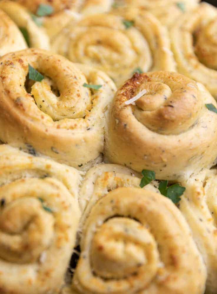 Garlic Herb Butter Rolls (Cinnamon Roll Style) bites with bri