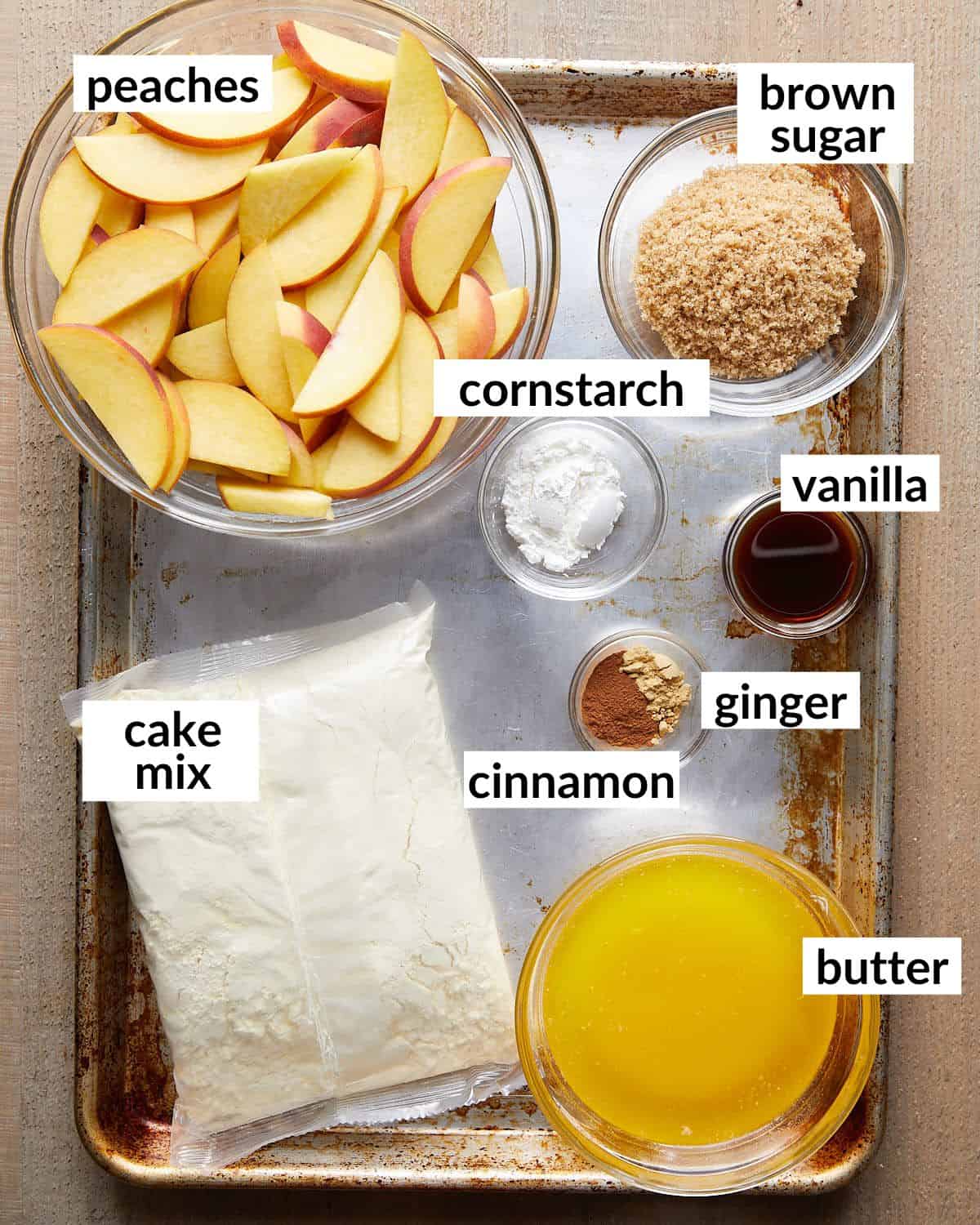 Overhead of ingredients needed to make peach dump cake.