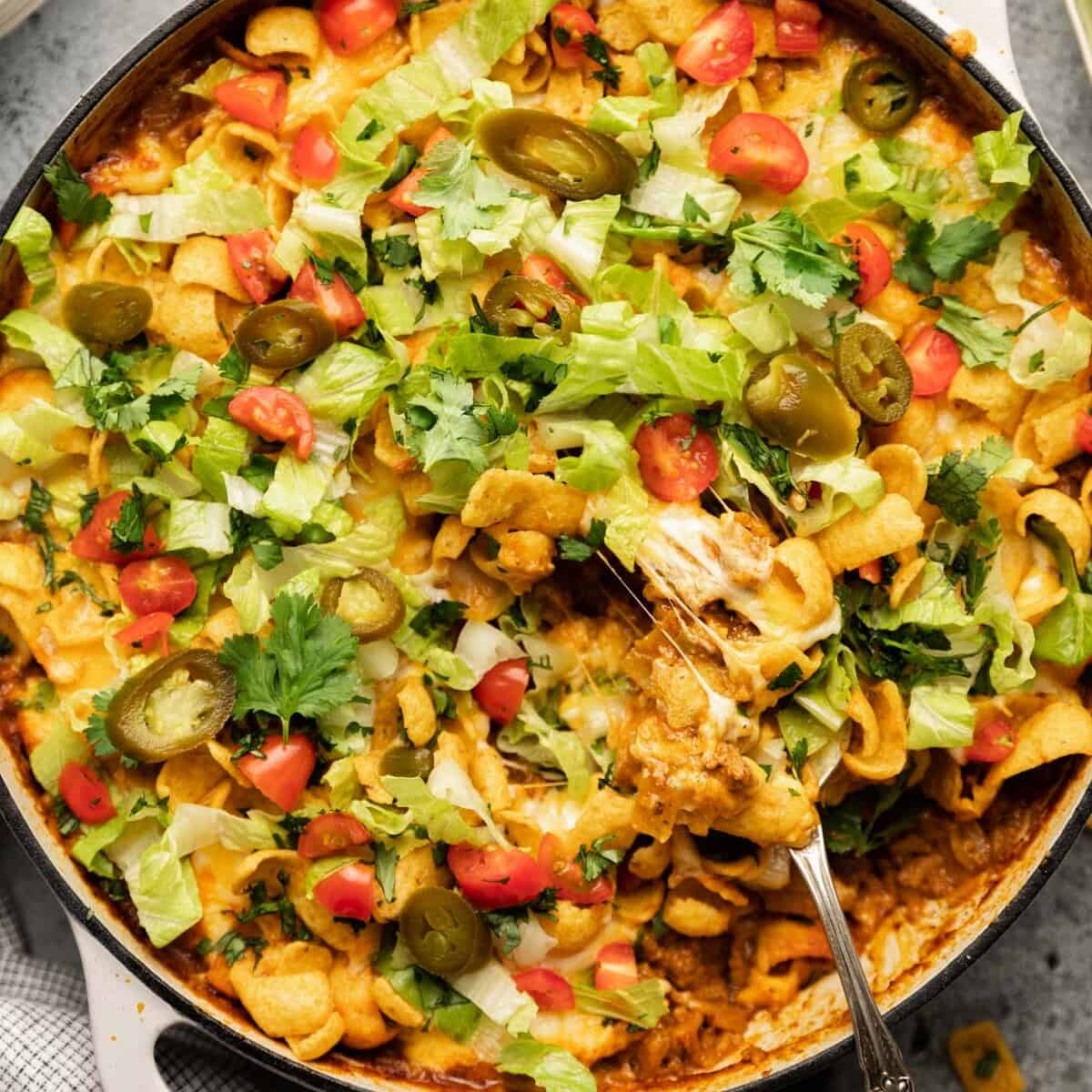Baked Walking Taco Casserole Recipe with Enchilada Sauce Bites with Bri
