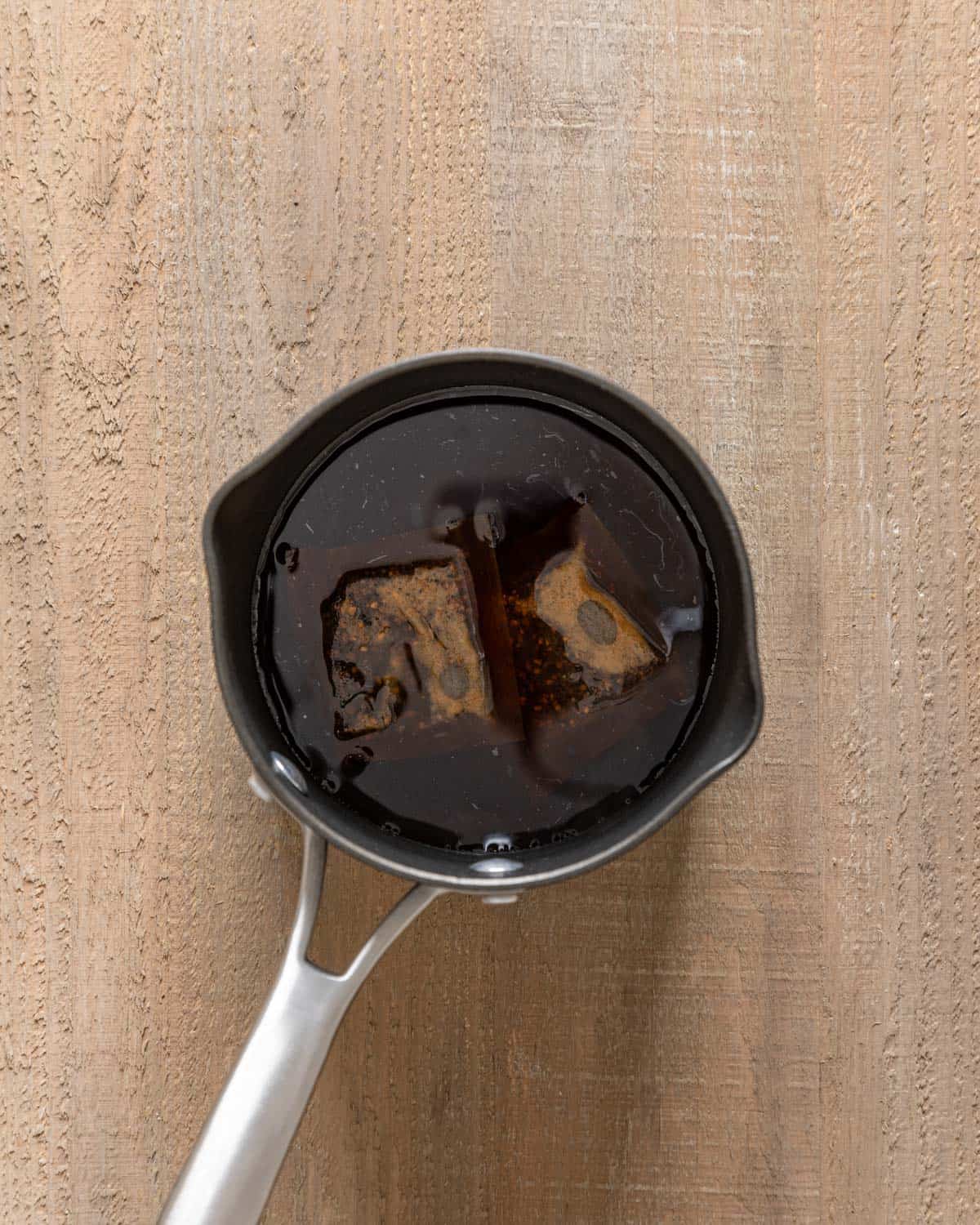 tea bags steeping in pot with boiling water