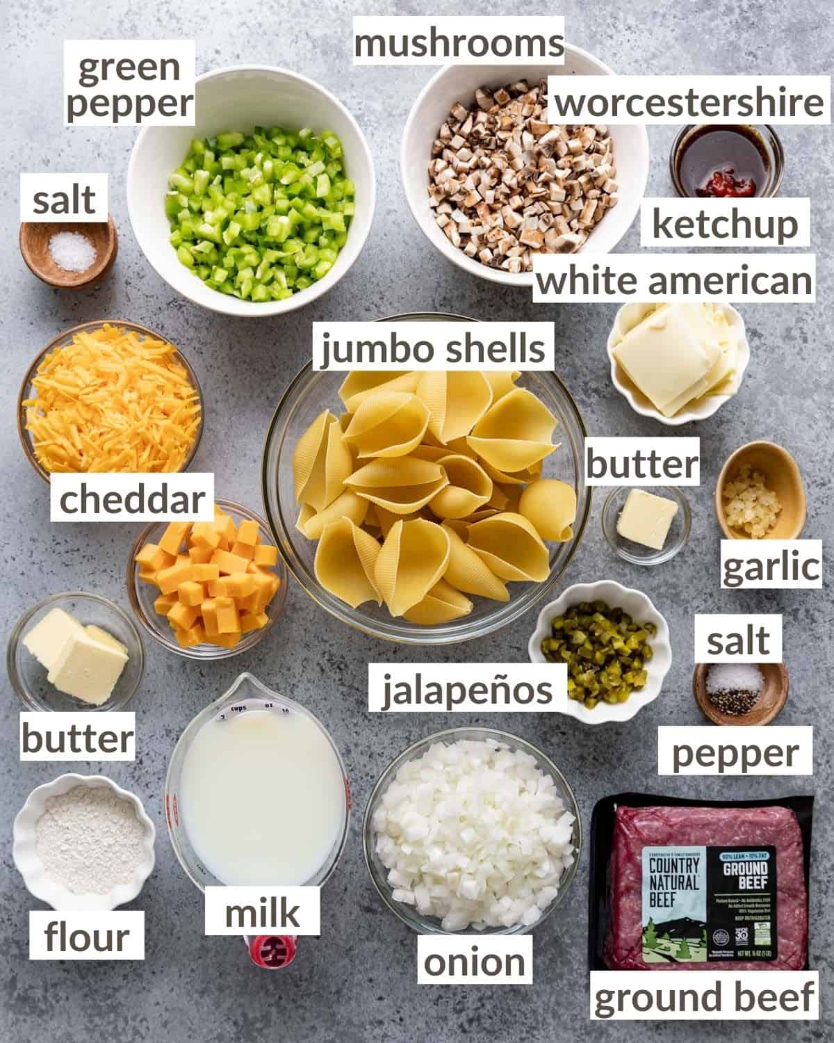 Overhead image of ingredients needed to make Philly cheesesteak stuffed shells with ground beef.