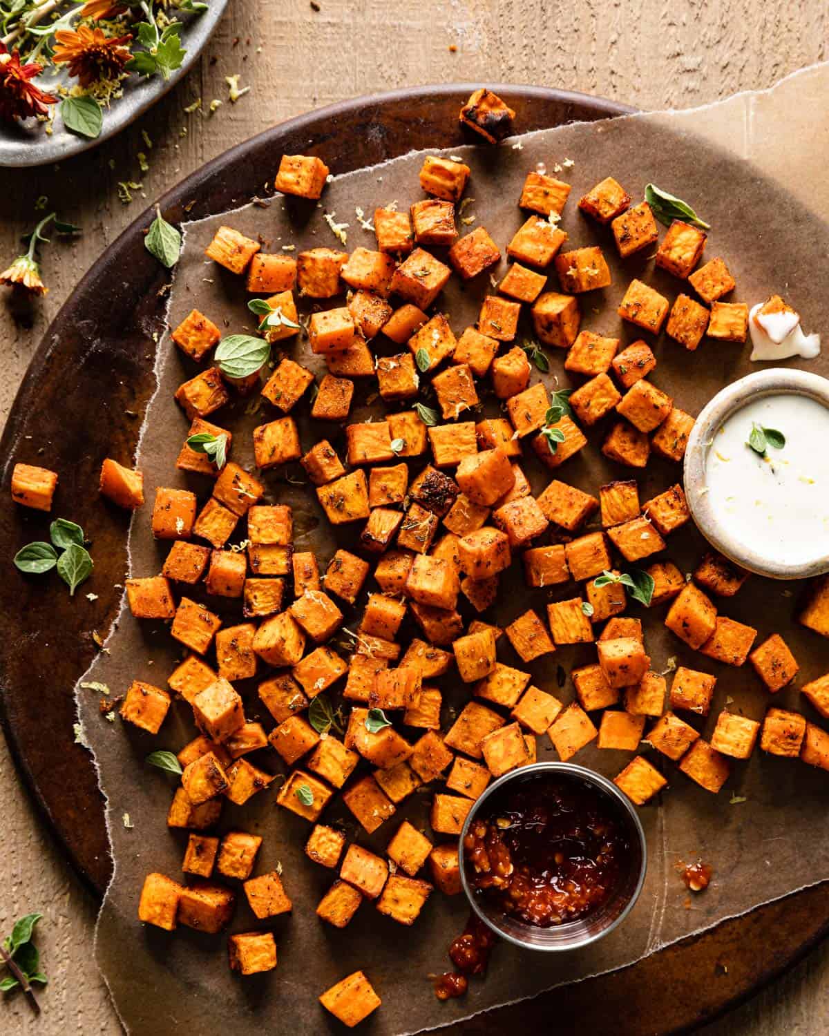 sweet potatoes on platter with sauce