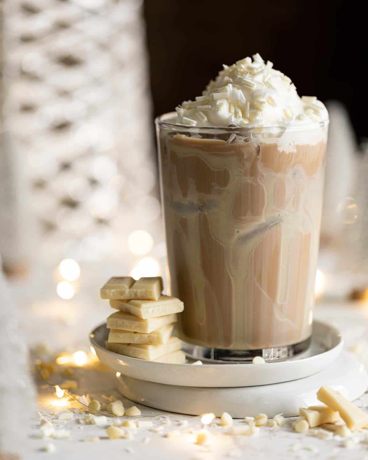 Iced white chocolate mocha recipe in a cup with whipped cream.