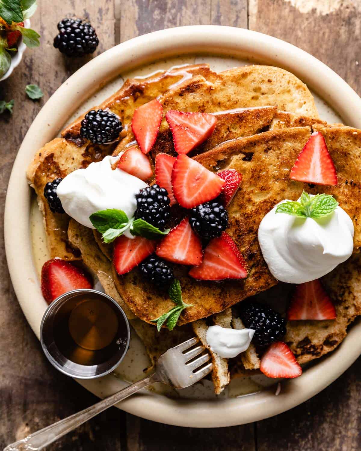 Sourdough french toast on a white plate.