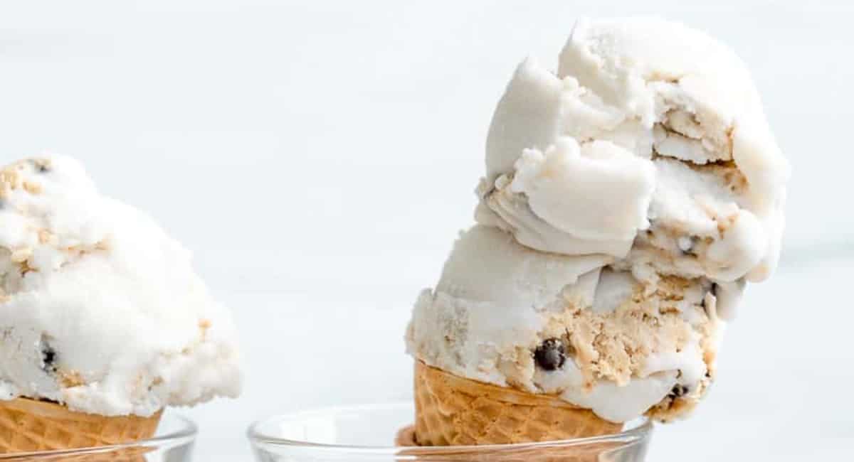 Vegan cookie dough ice cream served in a sugar cone.