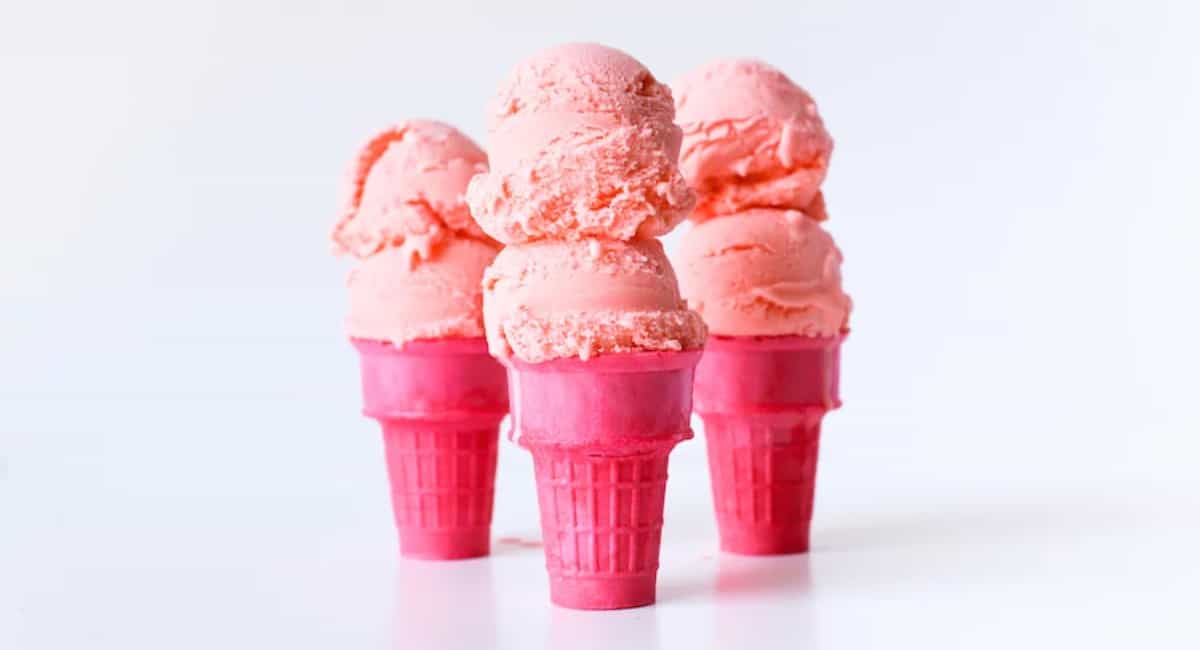 Cotton candy ice cream in pink sugar cones.