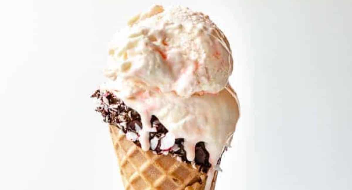 White chocolate peppermint ice cream served in a chocolate dipped waffle cone.