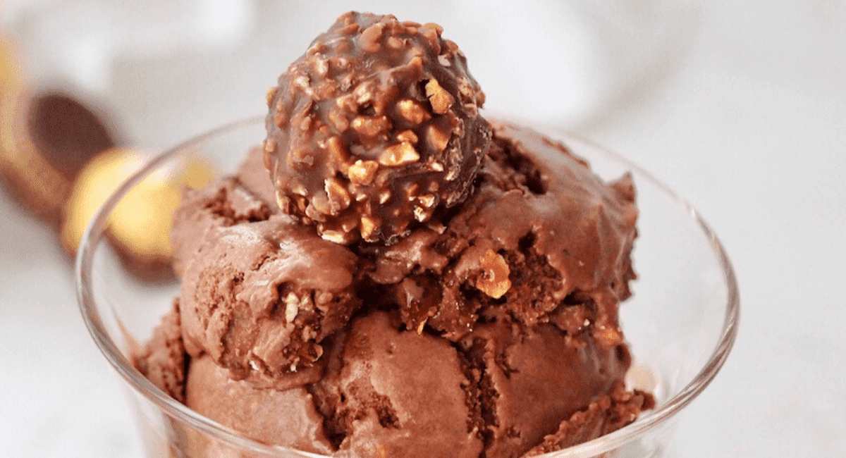 Ferrero rocher ice cream served in a clear bowl.