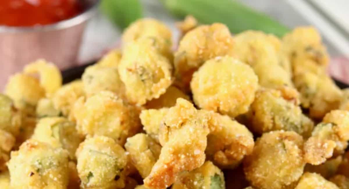 Fried okra in a pile and served with ketchup.