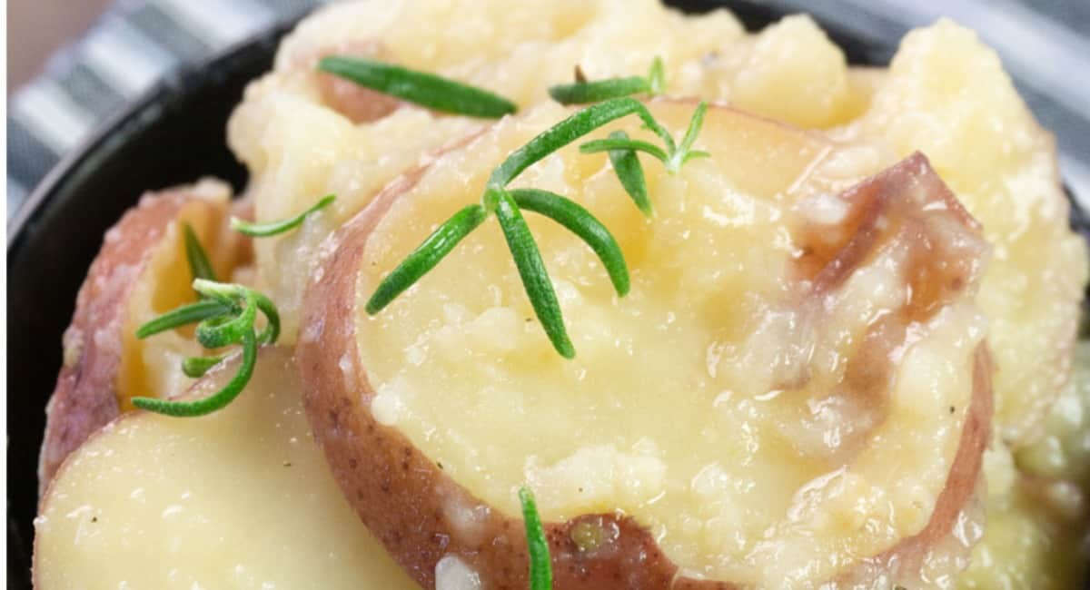 Instant pot buttered potatoes in a black bowl.