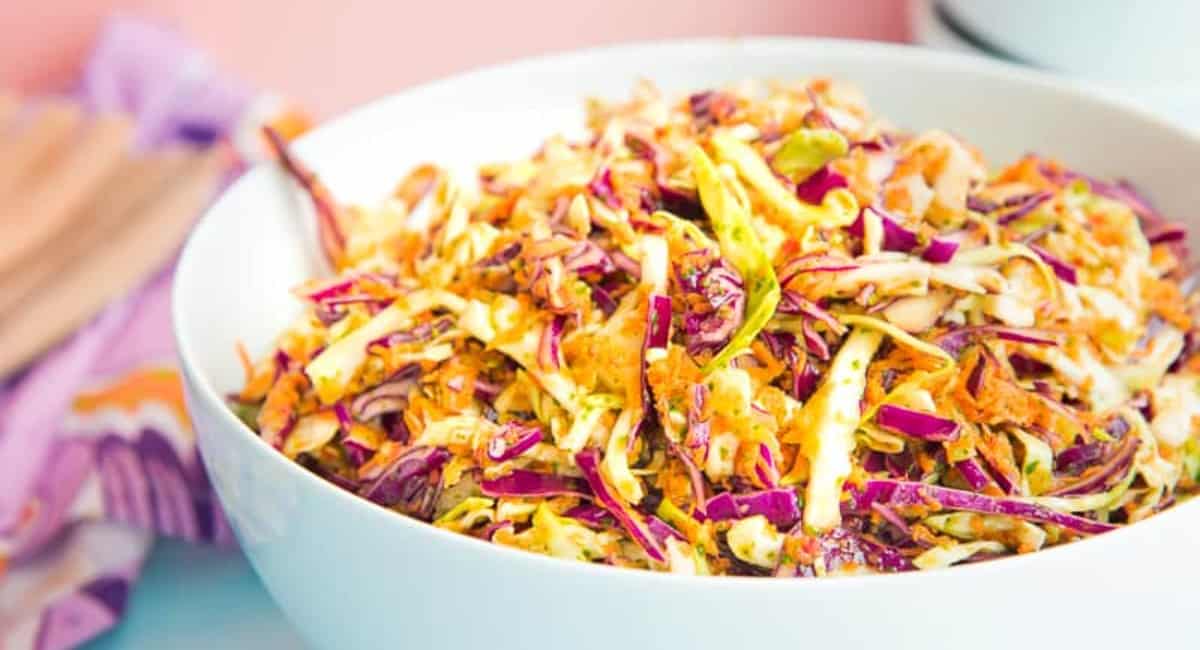 Peruvian coleslaw in a white bowl.