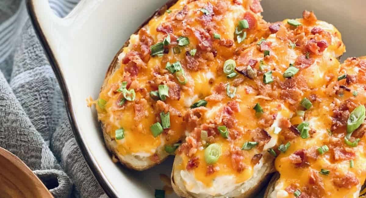 Twice baked potatoes in a white dish.