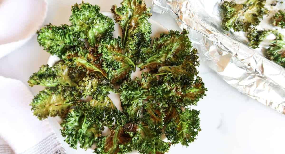 Kale chips on a white table.
