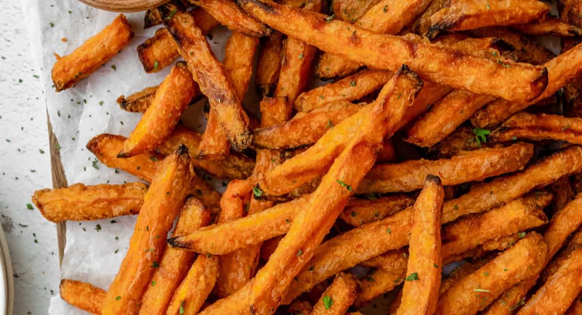 Sweet potato fries on parchment paper.