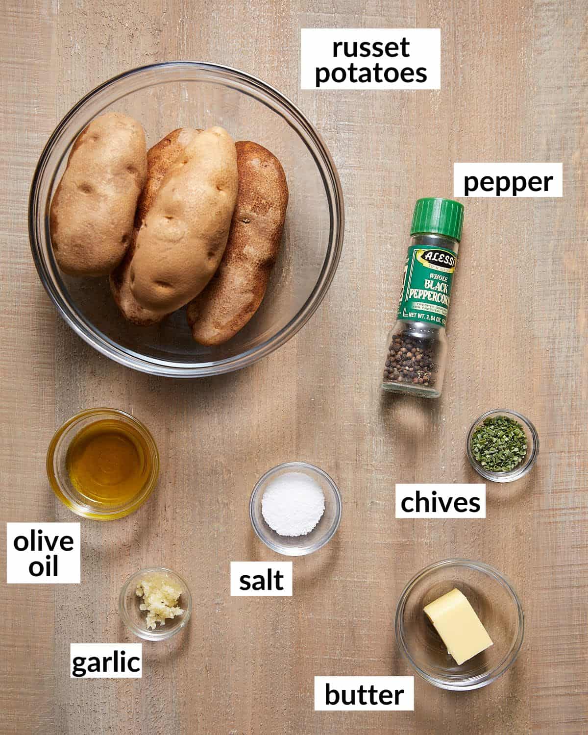 Ingredients in glass bowls needed to bake a potato. 