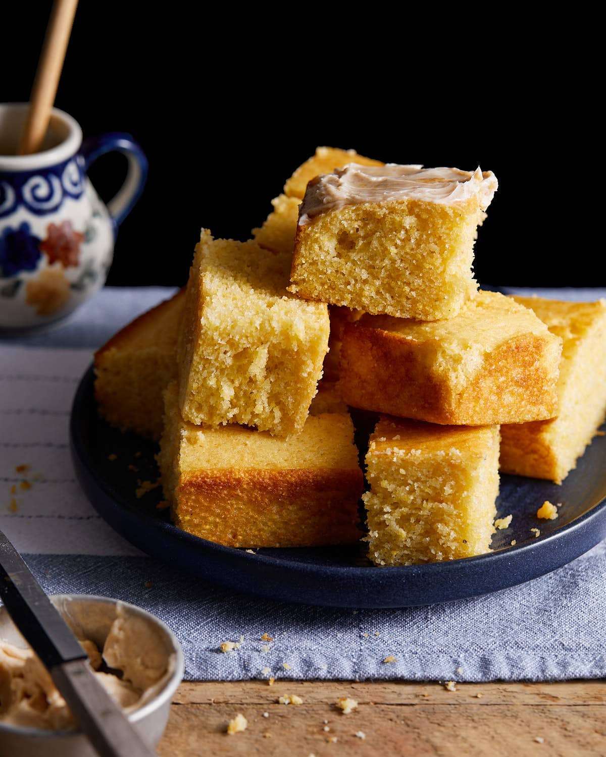 A stack of cornbread without buttermilk on a plate.