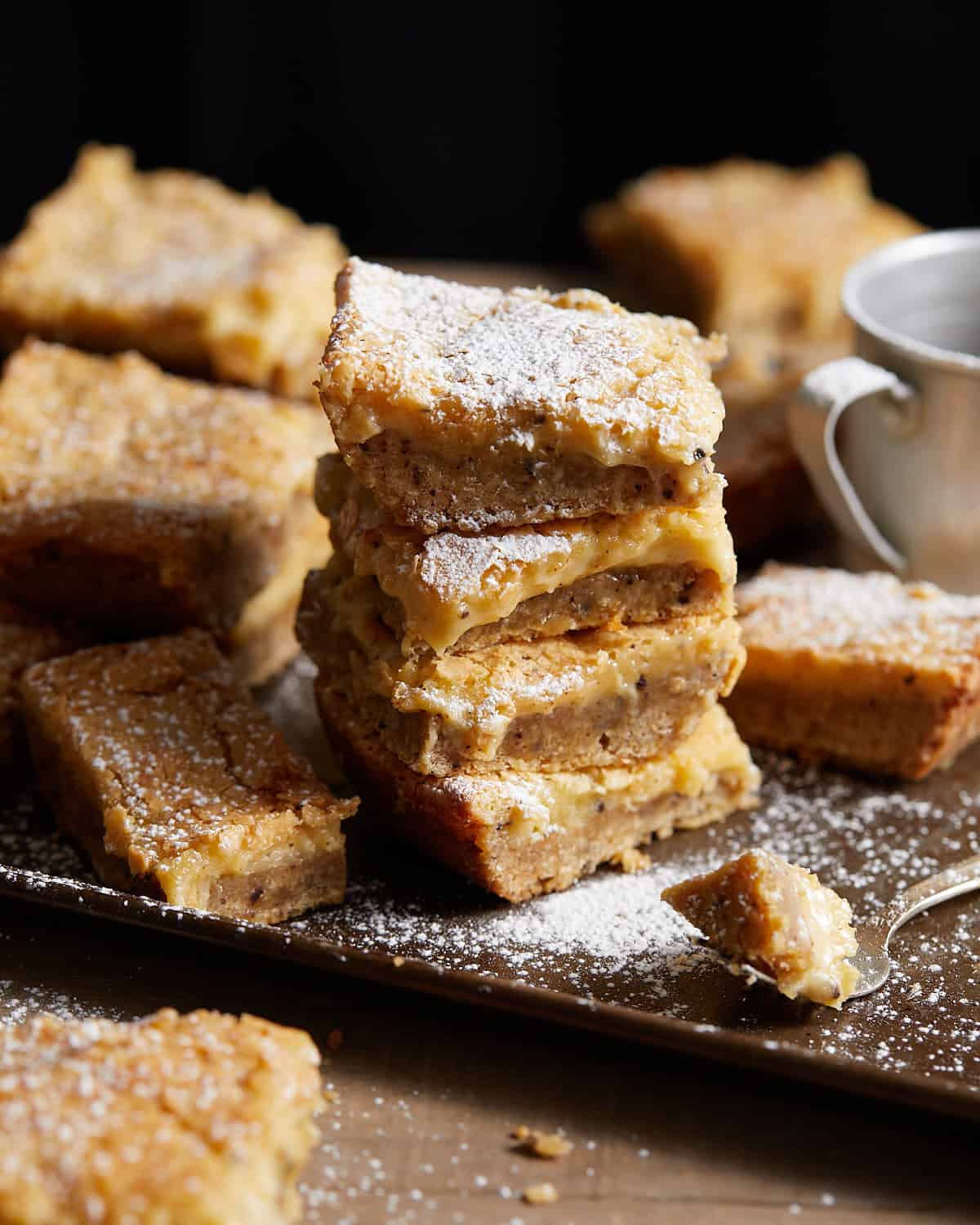 Image of stacked brown butter chess squares from scratch.