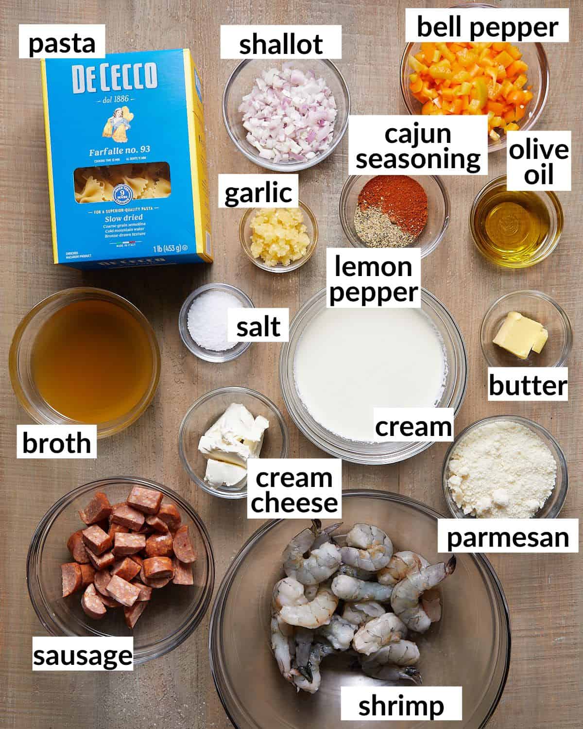 Image of ingredients needed to make creamy cajun shrimp and sausage pasta. 