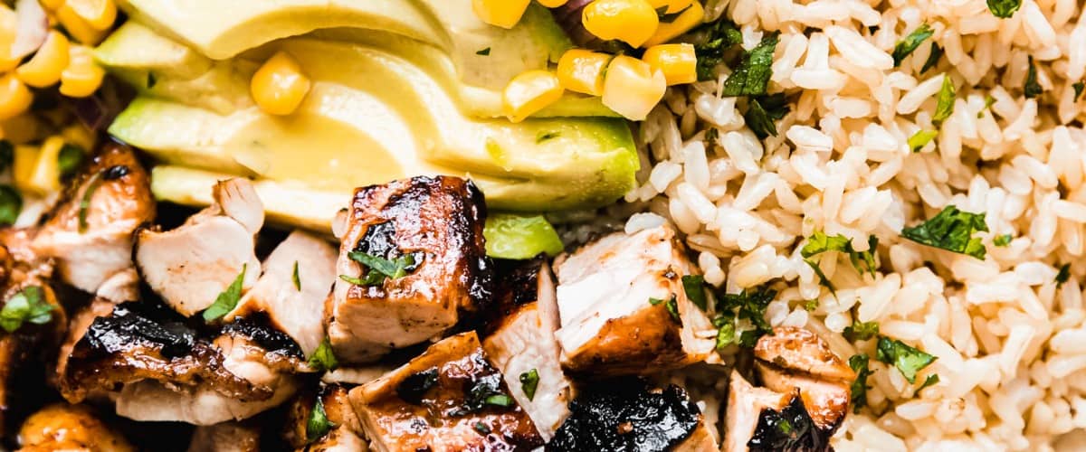 Honey chipotle chicken with corn salsa in a bowl.