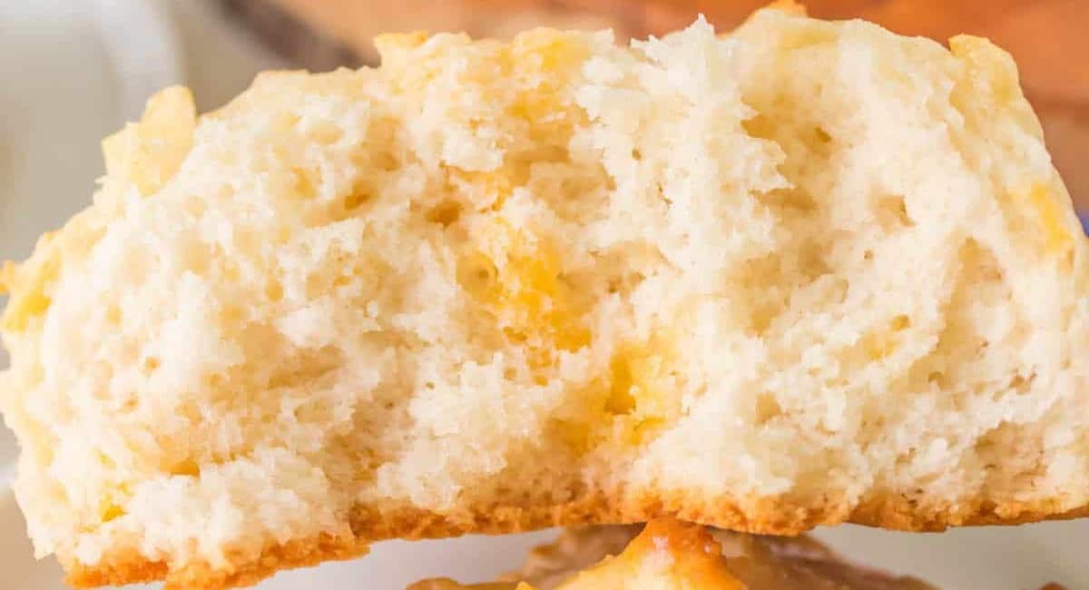 Up close image of bisquick cheddar biscuit cut in half.