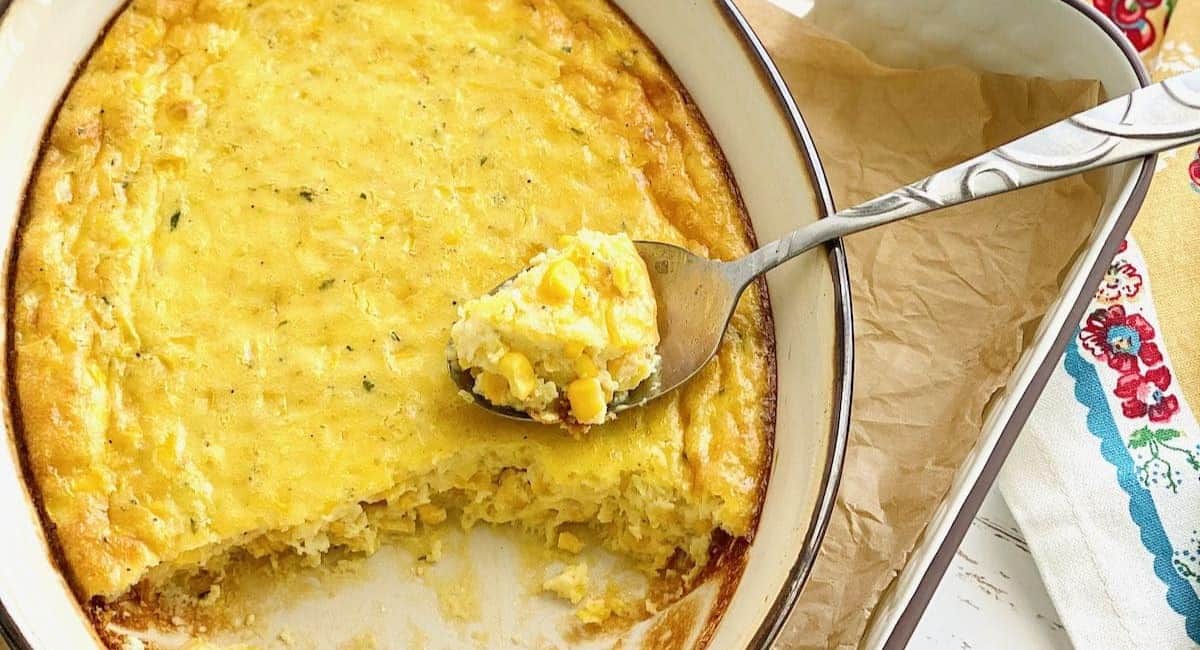 Photo of southern corn pudding in white dish. 