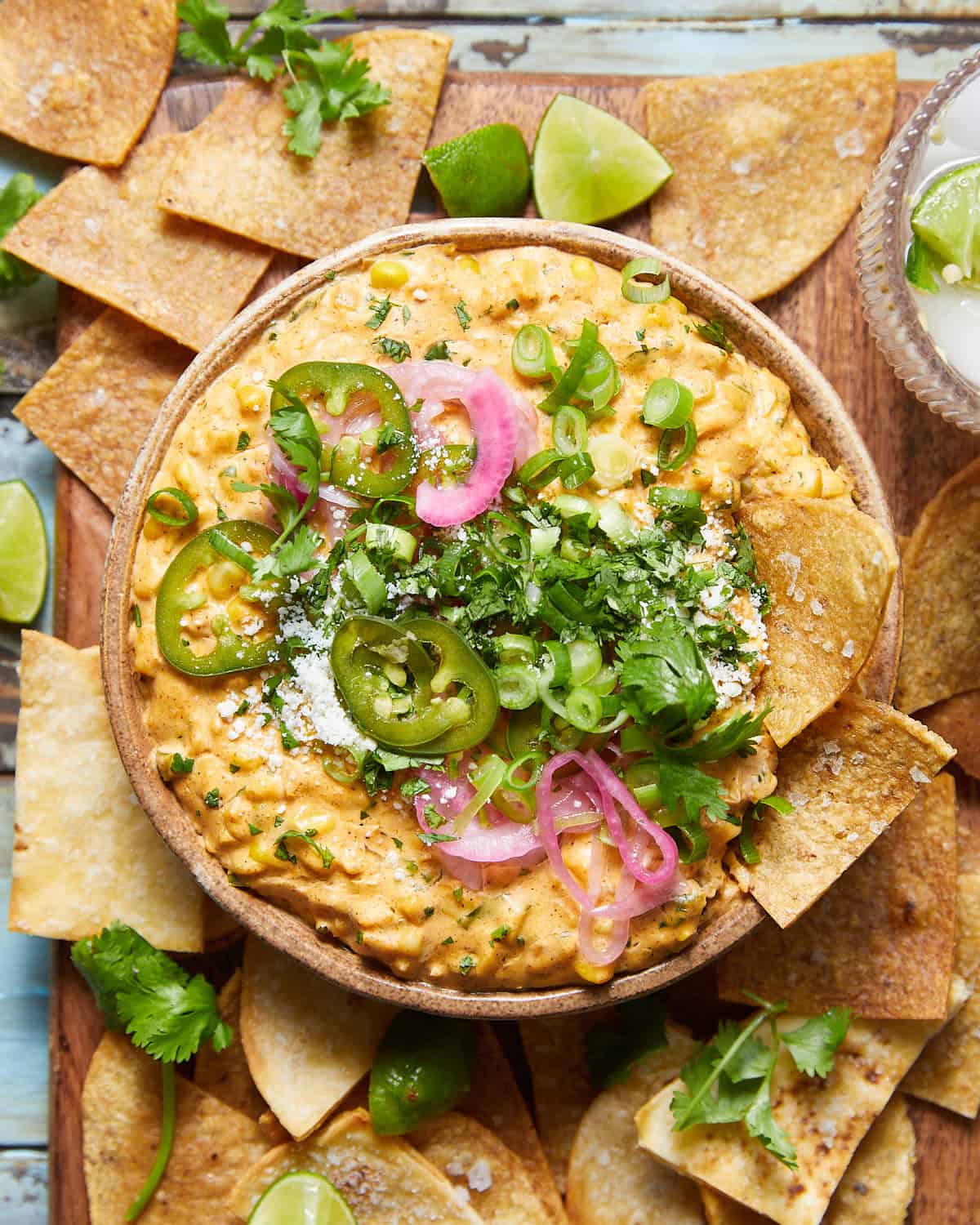 Overhead image of elote dip with garnish.