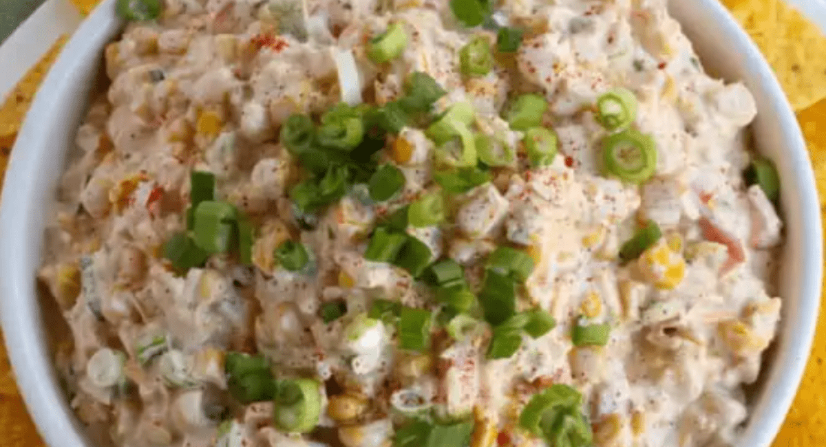 Overhead image of corn dip with garnish.