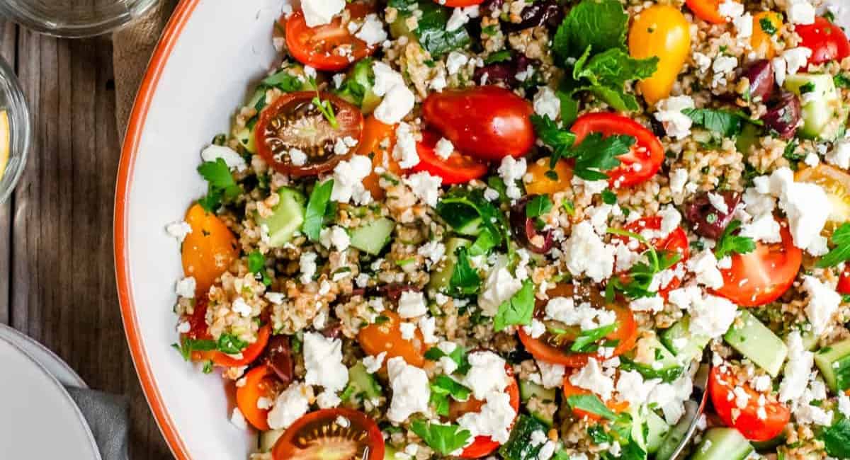 Overhead image of tabouli salad in white bowl.