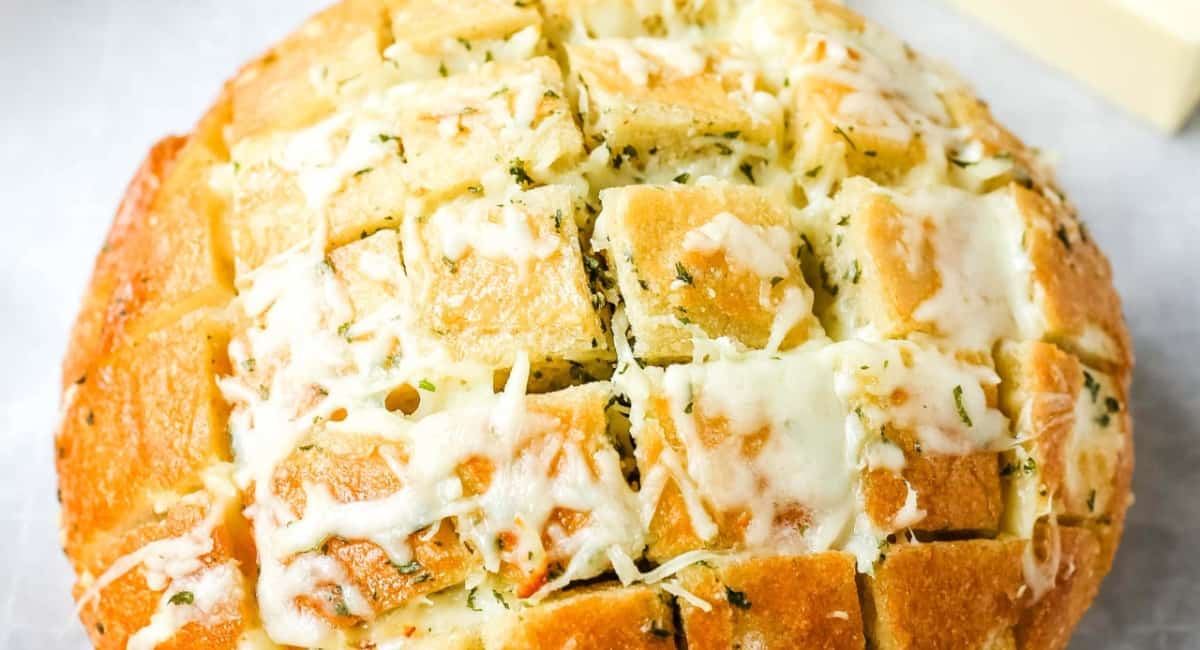 Overhead image of cheesy pull-apart garlic bread.