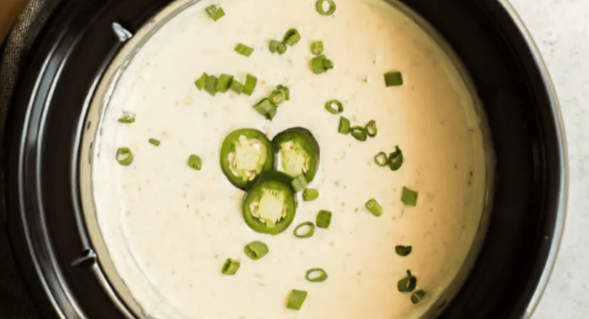 Overhead image of slow cooker queso verde. 