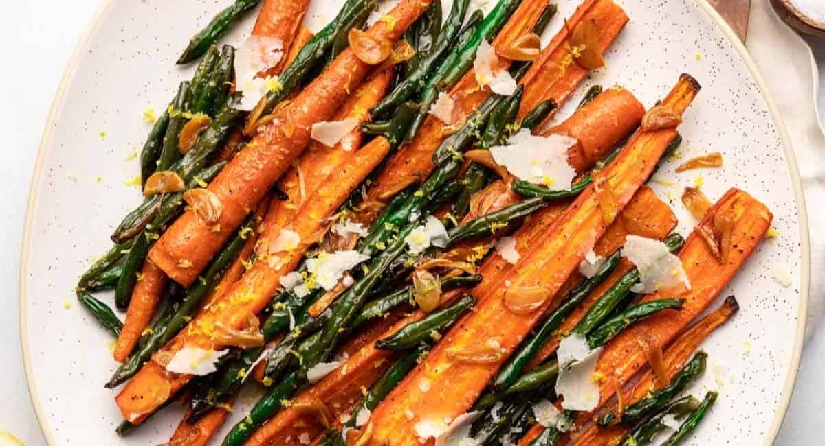 Overhead image of roasted green beans and carrots.