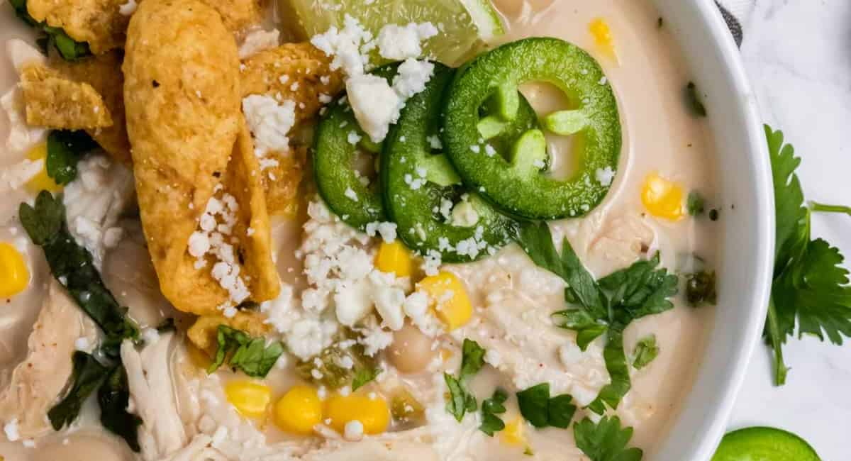 Overhead image of slow cooker sirachc lime white chicken chili.