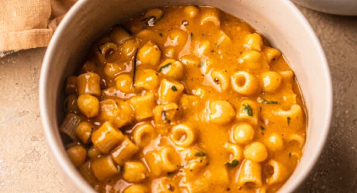 Overhead image of gochujang pasta e ceci in white bowl.