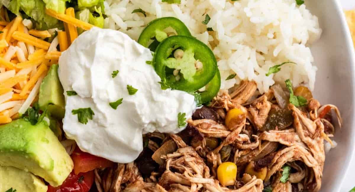Overhead image of slow cooker burrito bowls.