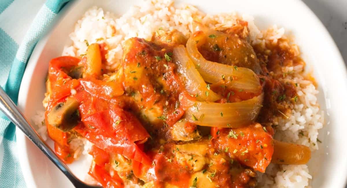 Overhead image of easy chicken cacciatore on bed of rice.