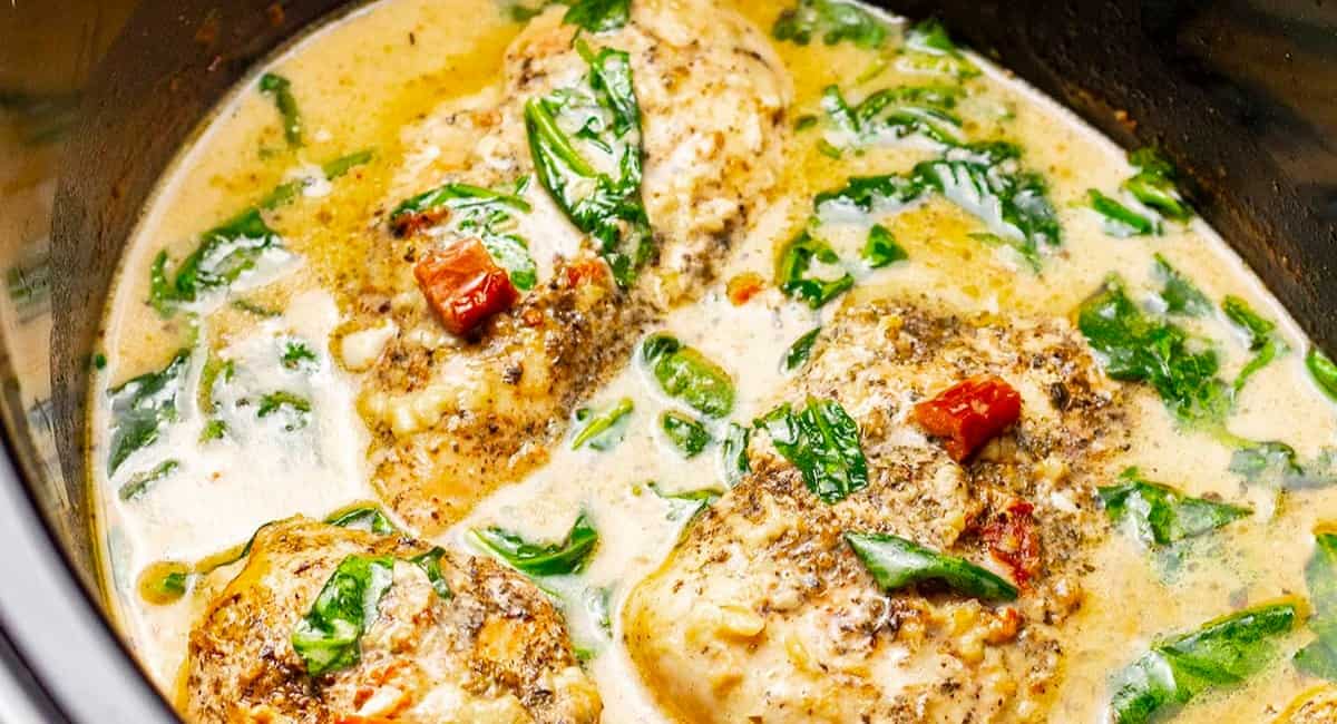 Overhead image of crock pot creamy Tuscany garlic chicken.