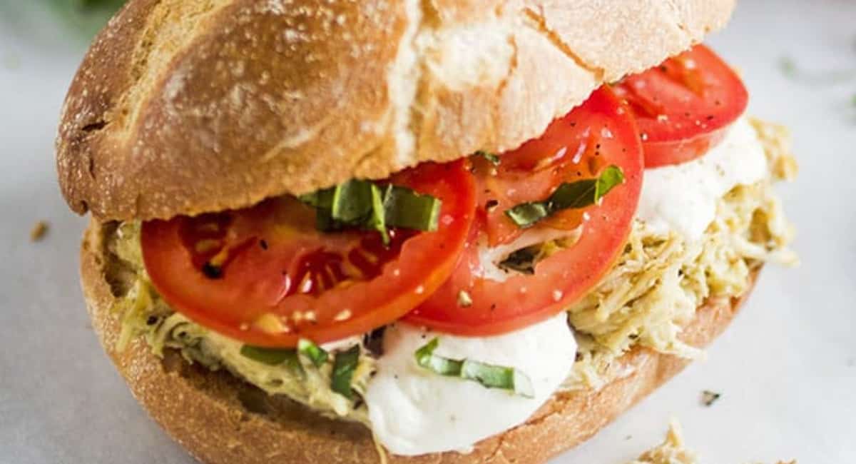 Overhead image of slow cooker pesto chicken sandwiches.