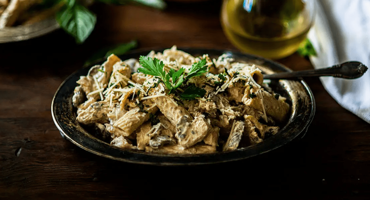 Overhead image of blackened chicken with creamy mushroom sauce.