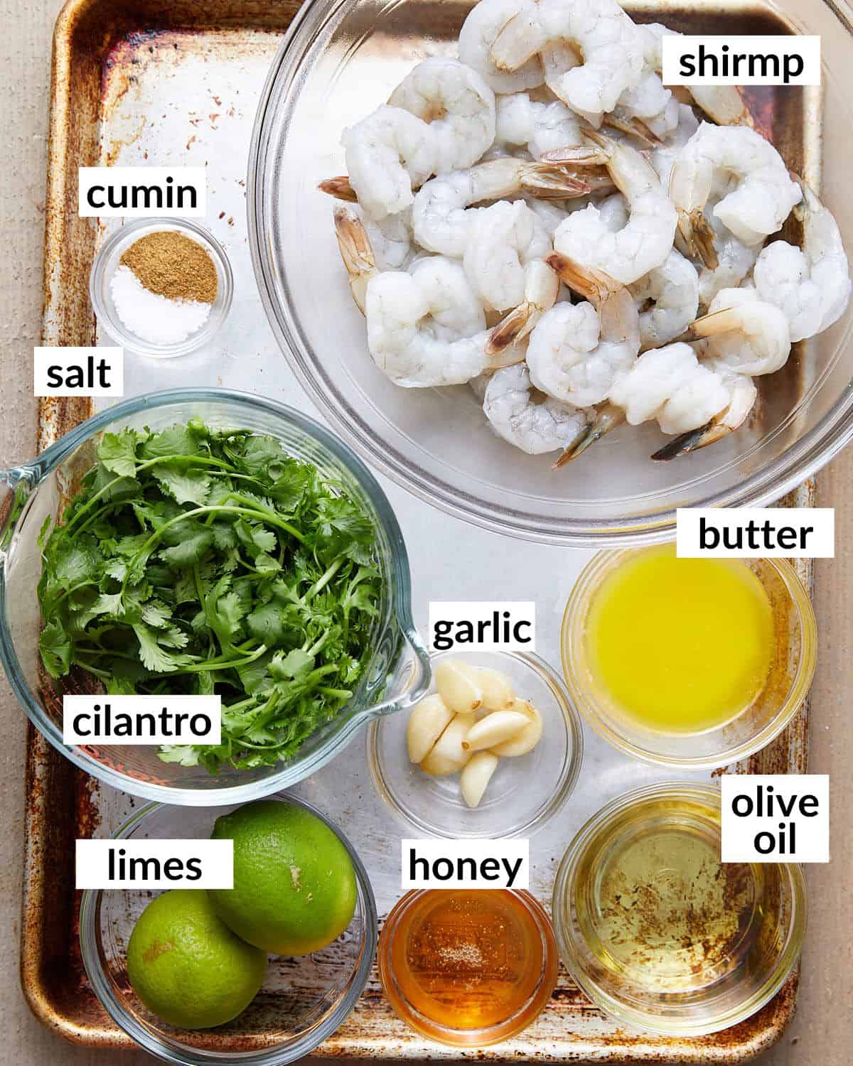 Overhead image of ingredients needed for oven baked shrimp skewers.