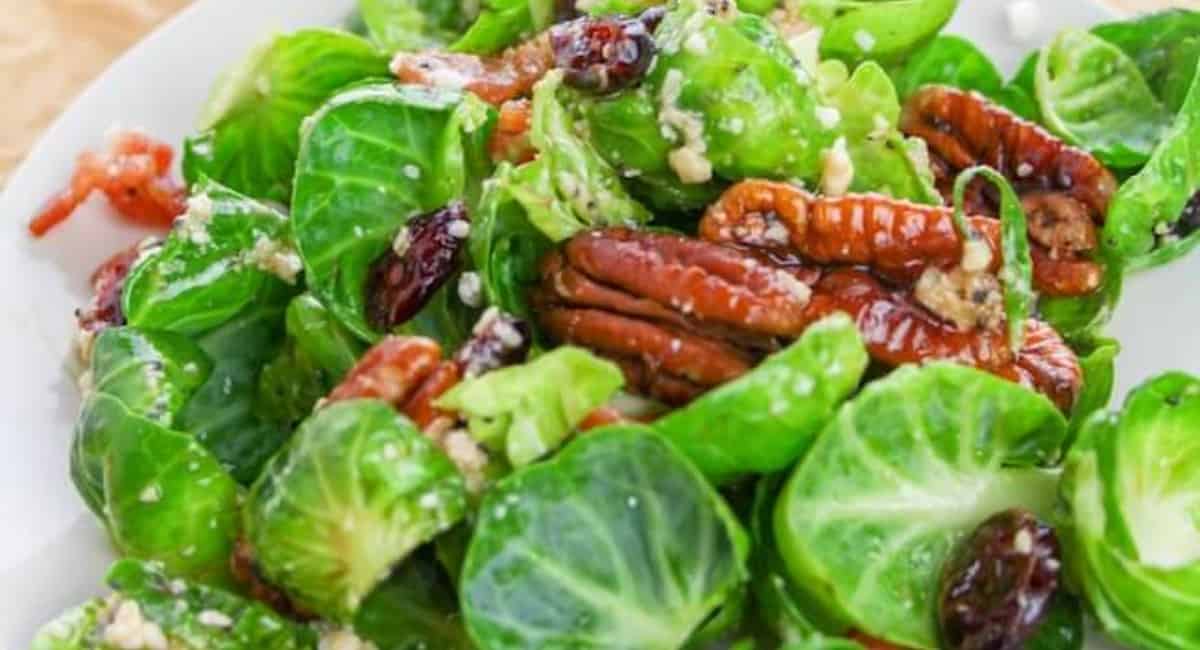 Up close image of brussel sprout salad with bacon and poppyseed vinaigrette. 