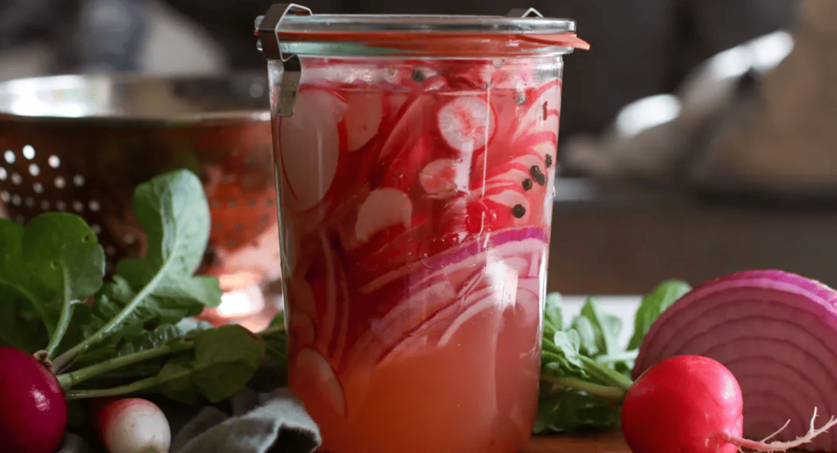 Image of pickled radishes in glass container. 