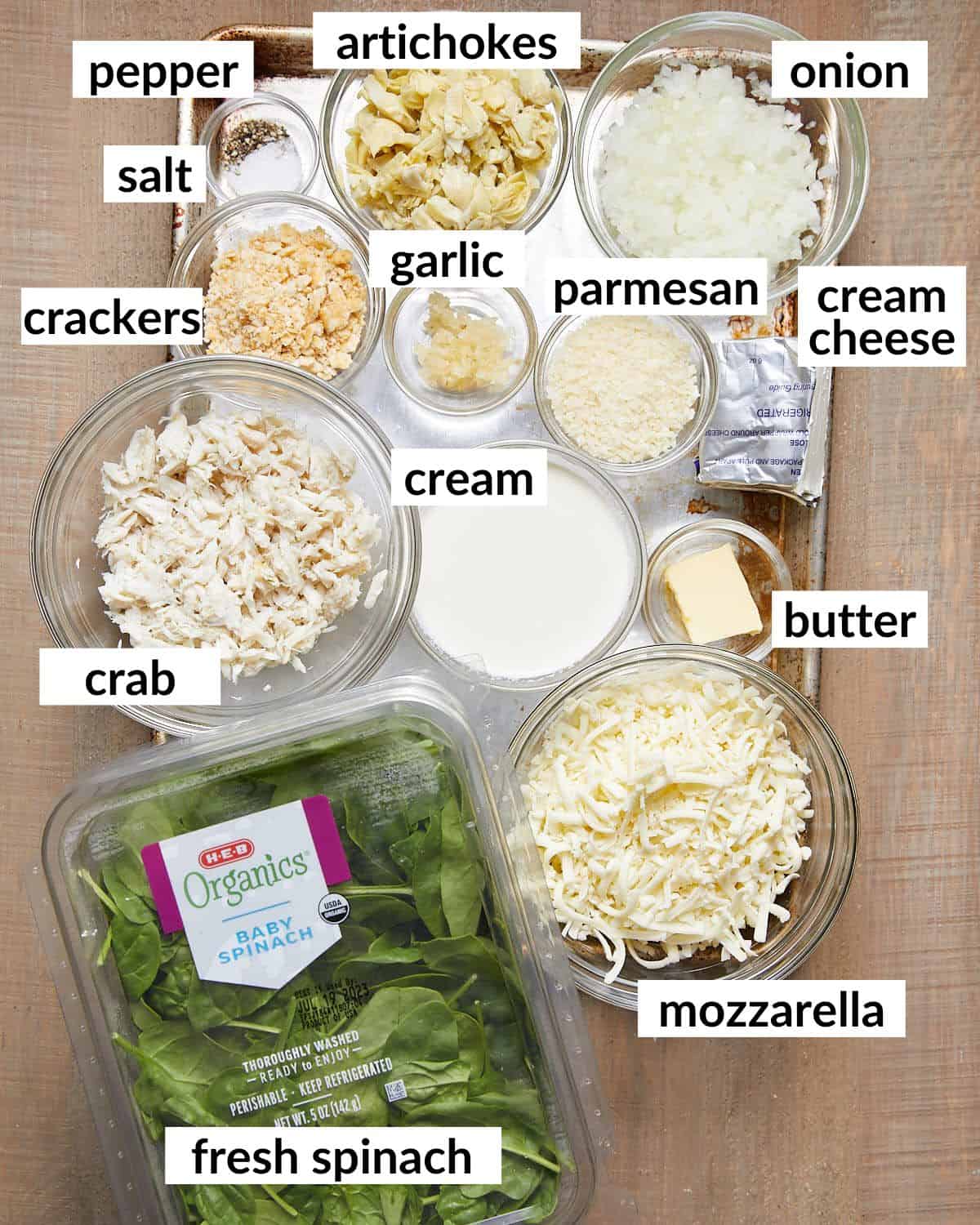 Overhead image of ingredients needed to make crab spinach artichoke dip.