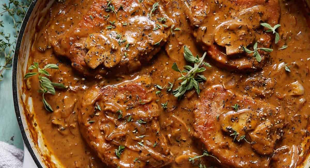 Overhead image of dutch oven pork chops.