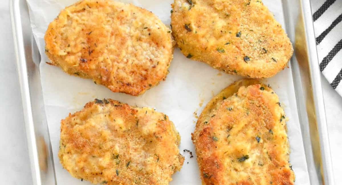 Overhead image of baked breaded pork chops.