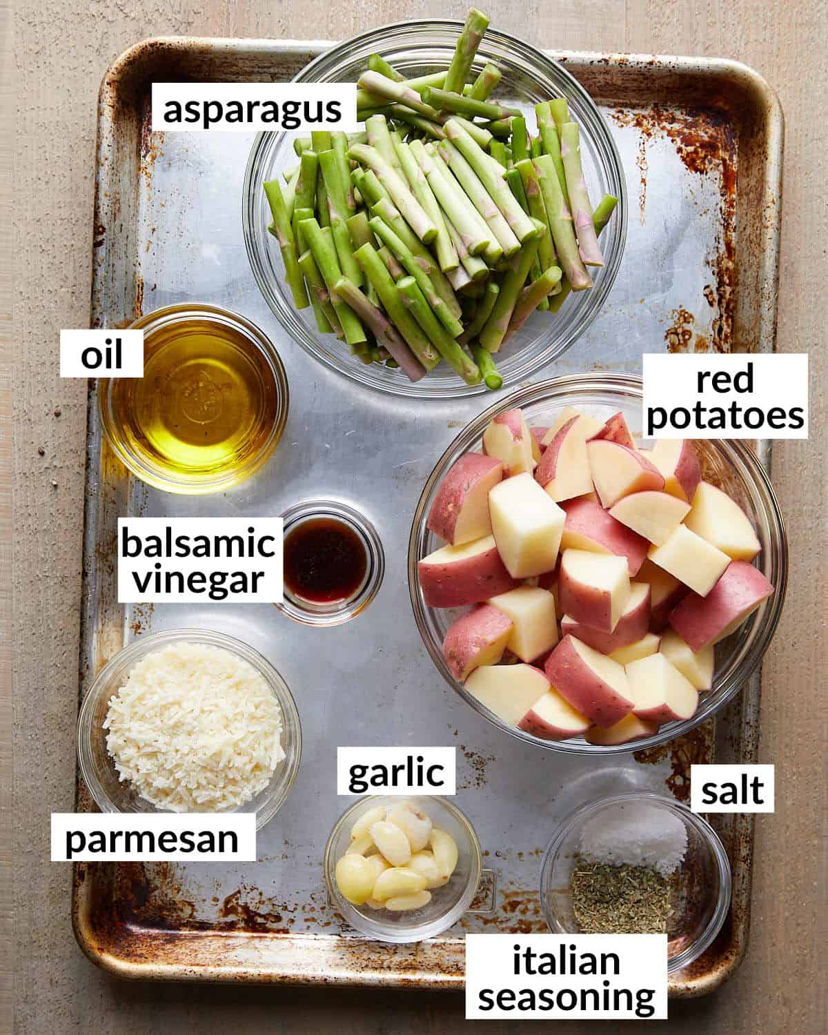 Overhead image of ingredients needed for roasted potatoes and asparagus. 