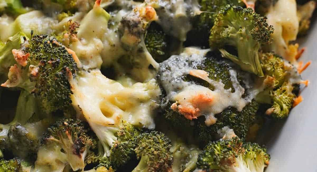 Up close image of cheesy garlic broccoli. 