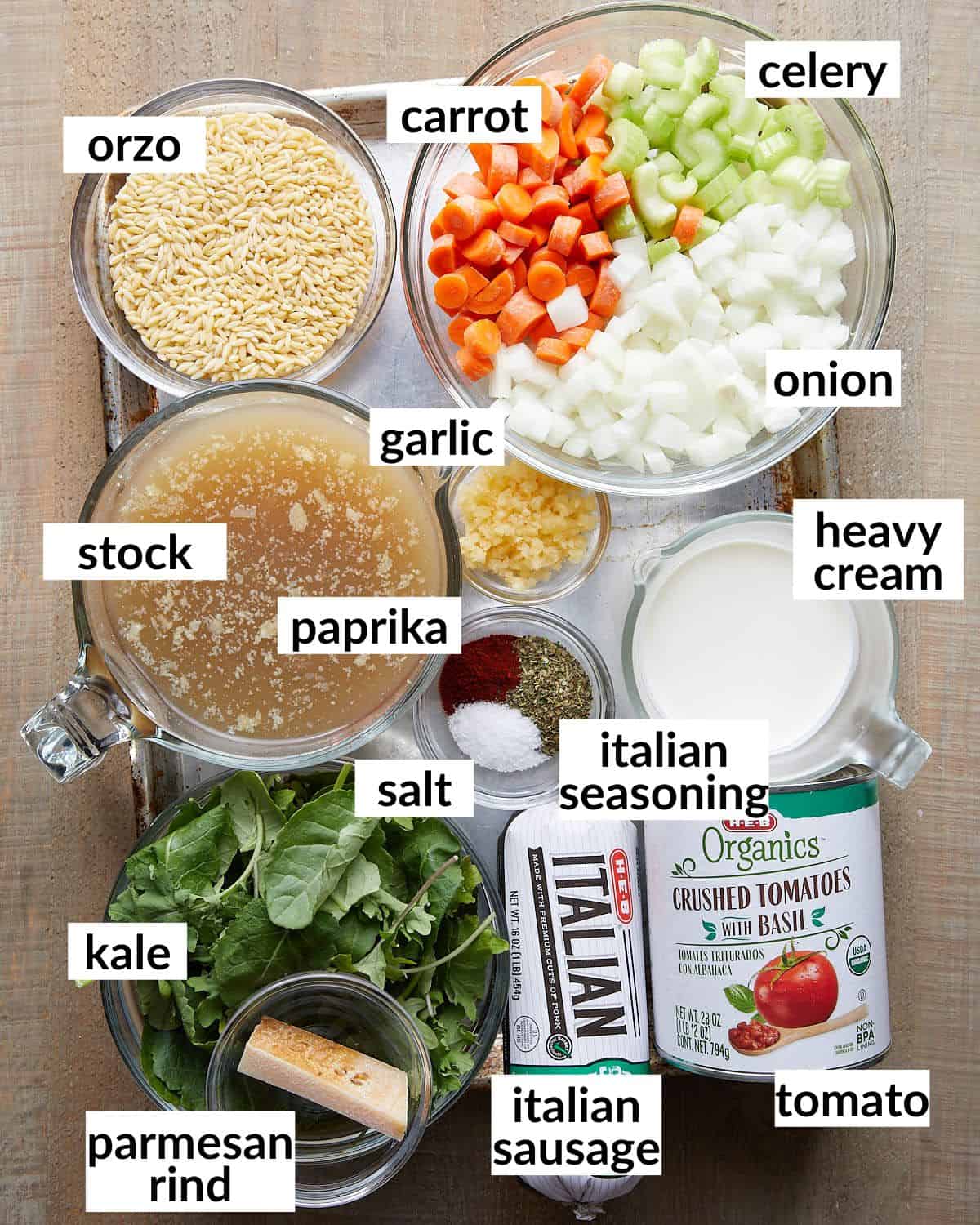 Overhead image of ingredients needed to make creamy Italian sausage soup. 