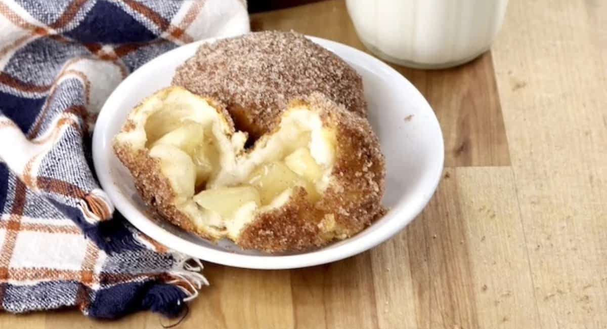 Up close image of air fryer churro apple pie bombs.