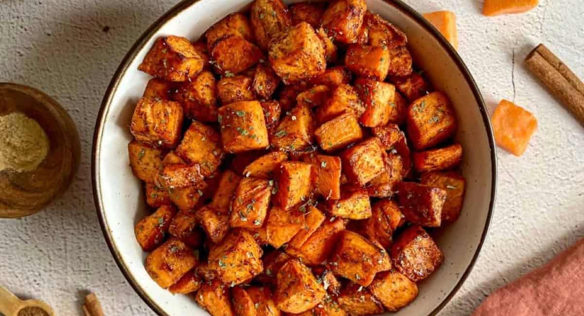 Overhead image of maple cinnamon air fryer sweet potato cubes.